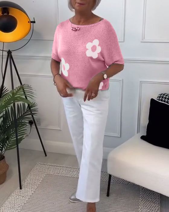 Wąski sweterek w kwiaty z okrągłym dekoltem