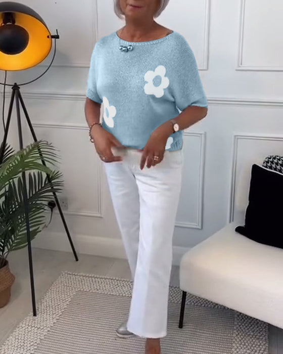 Wąski sweterek w kwiaty z okrągłym dekoltem