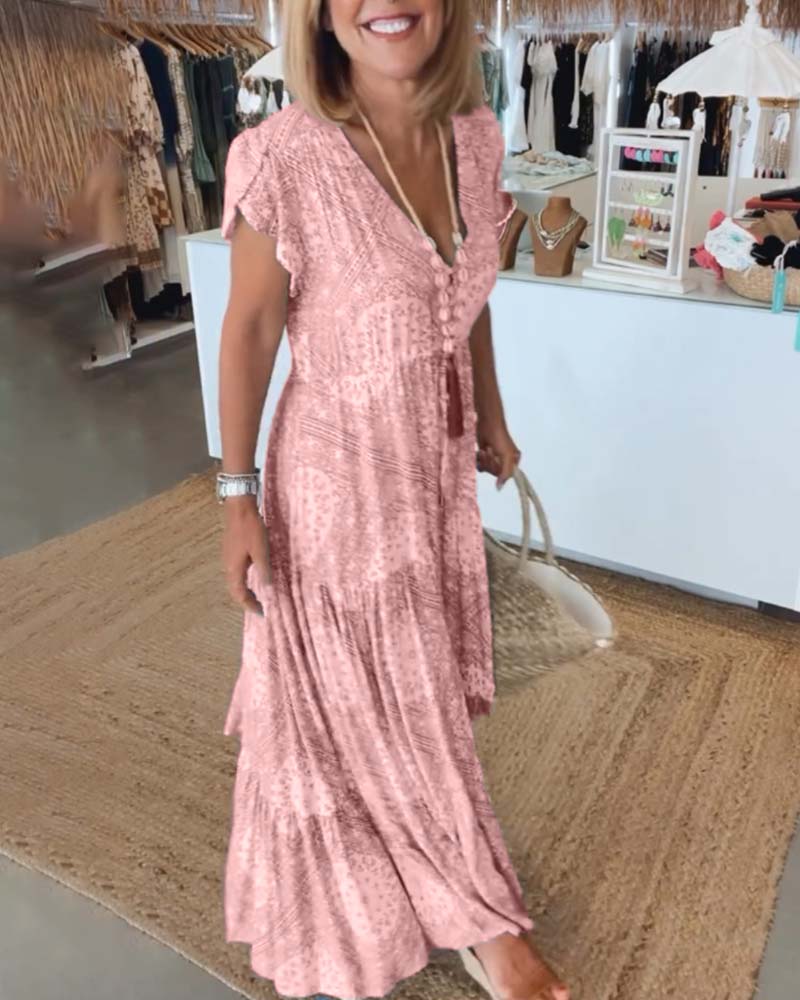 Wakacyjna sukienka z dekoltem w kształcie litery V i rozciętymi rękawami