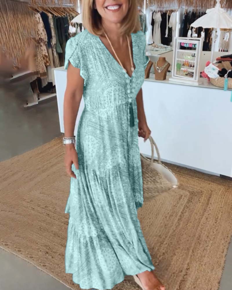 Wakacyjna sukienka z dekoltem w kształcie litery V i rozciętymi rękawami