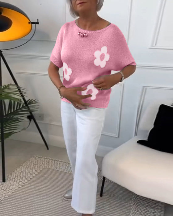 Wąski sweterek w kwiaty z okrągłym dekoltem