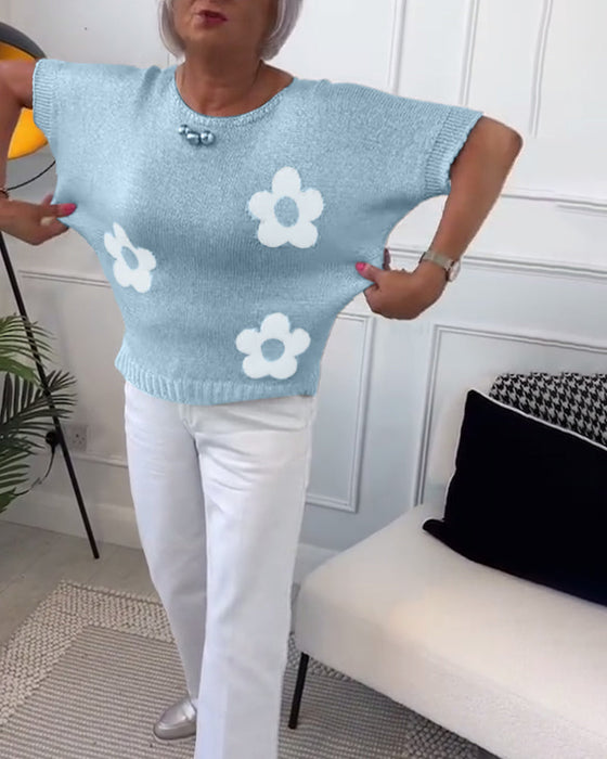 Wąski sweterek w kwiaty z okrągłym dekoltem