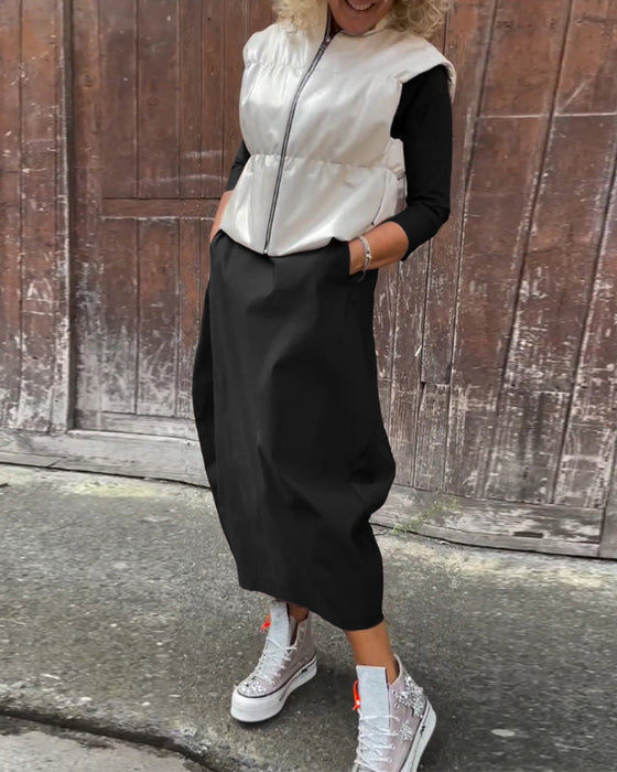 Prosta jednokolorowa elegancka sukienka z długim rękawem i kieszeniami