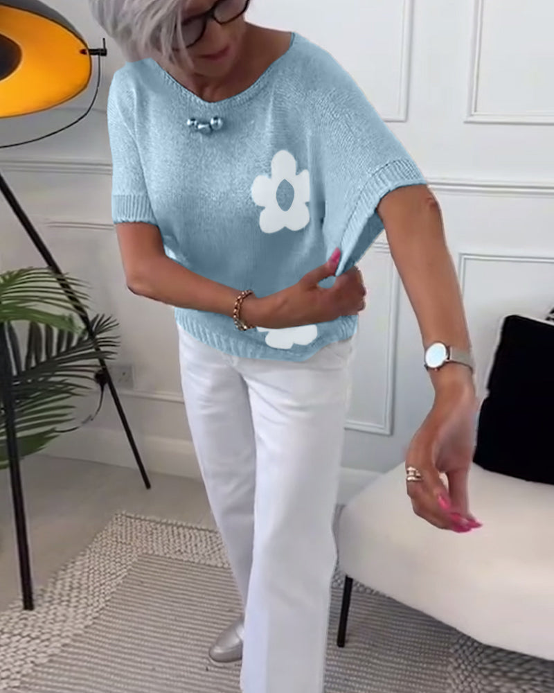 Wąski sweterek w kwiaty z okrągłym dekoltem