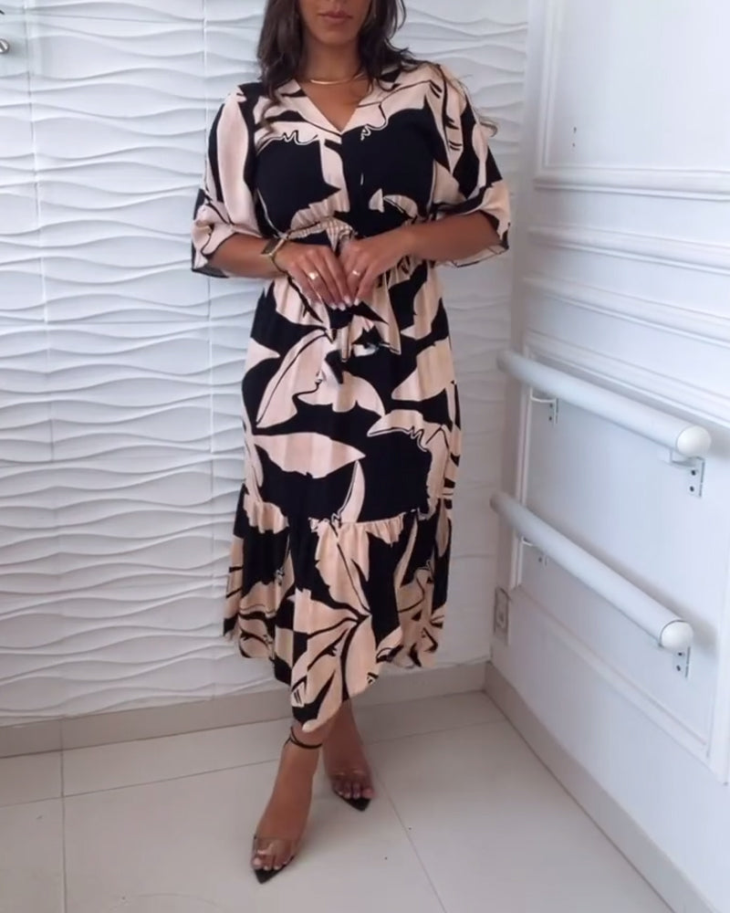 Elegancka sukienka z dekoltem w kształcie litery V i rękawami trzy czwarte