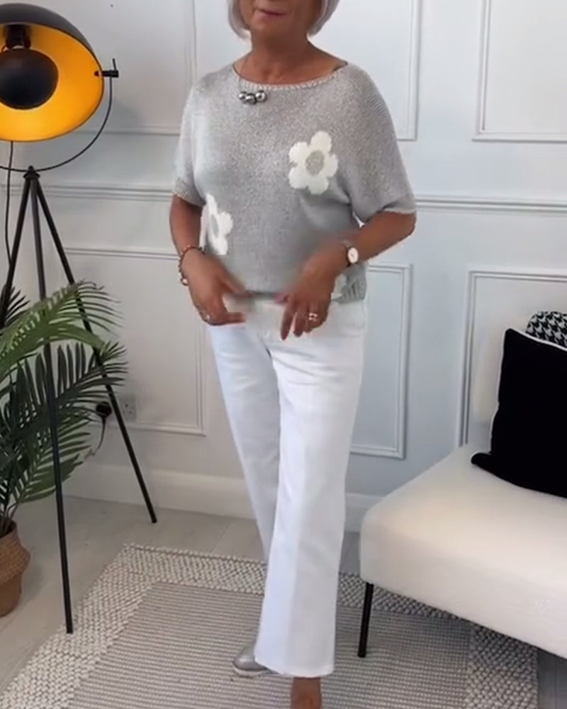 Wąski sweterek w kwiaty z okrągłym dekoltem