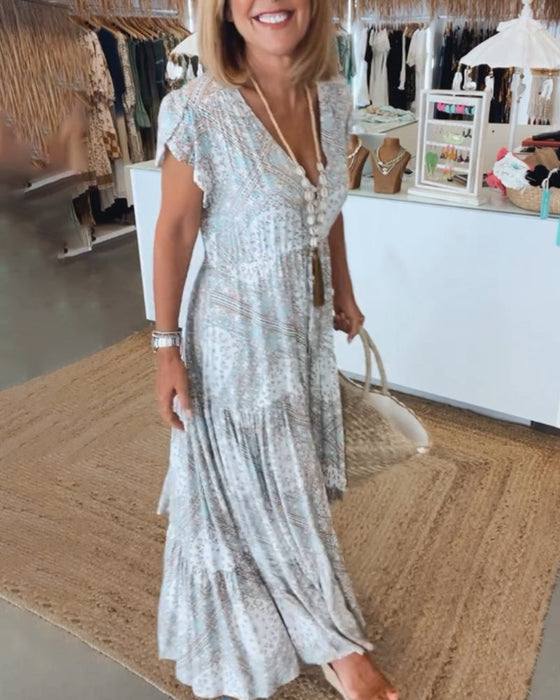 Wakacyjna sukienka z dekoltem w kształcie litery V i rozciętymi rękawami