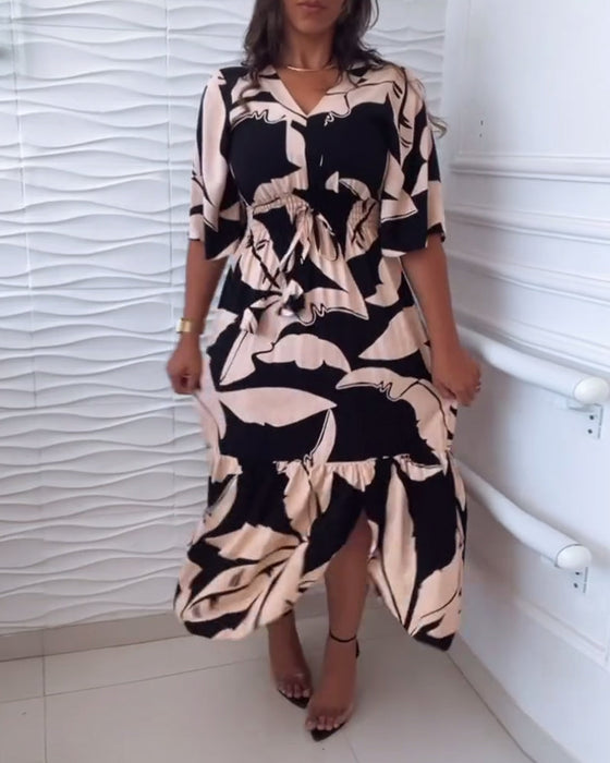 Elegancka sukienka z dekoltem w kształcie litery V i rękawami trzy czwarte